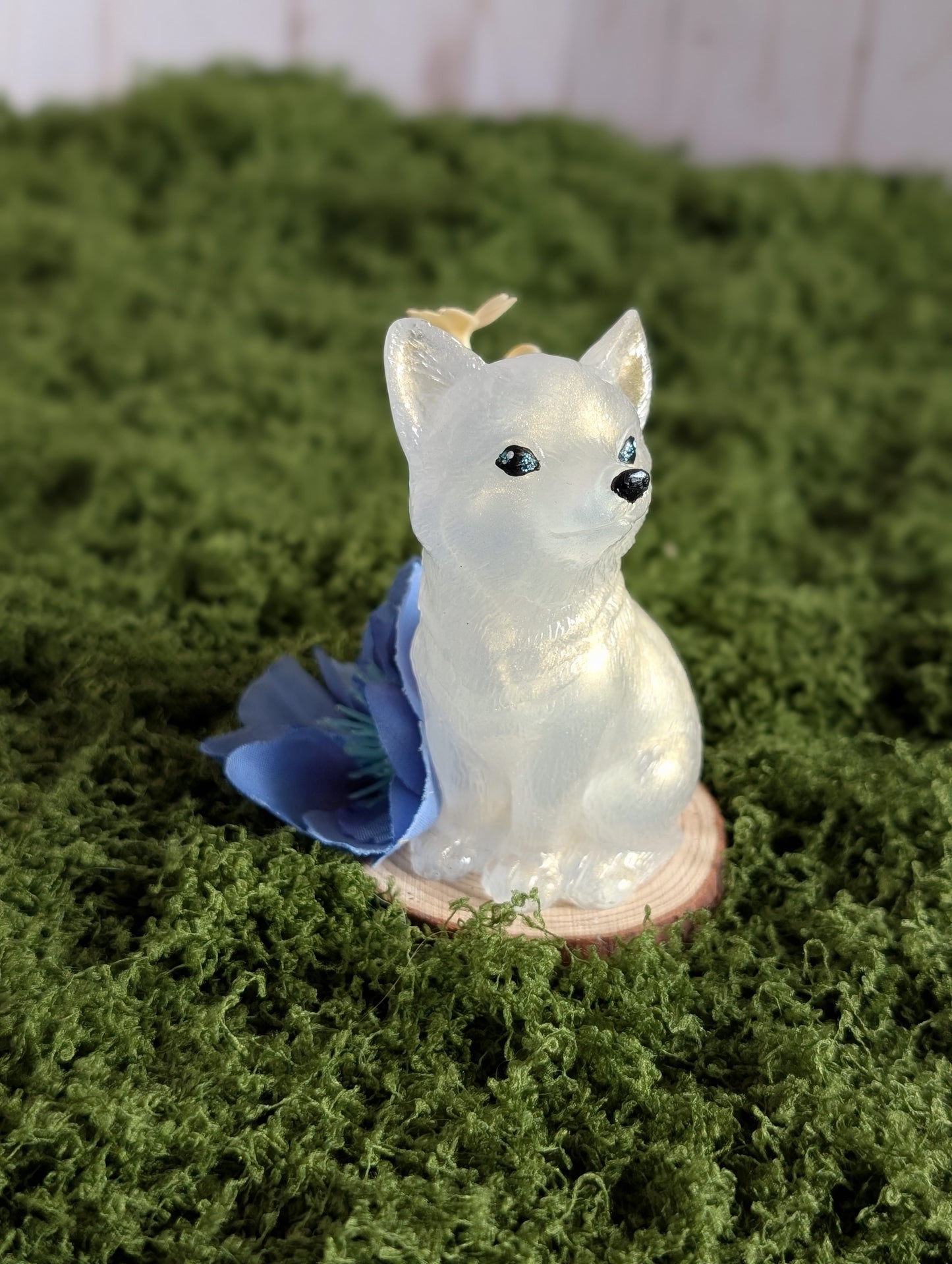 White Puppy with Blue Flower