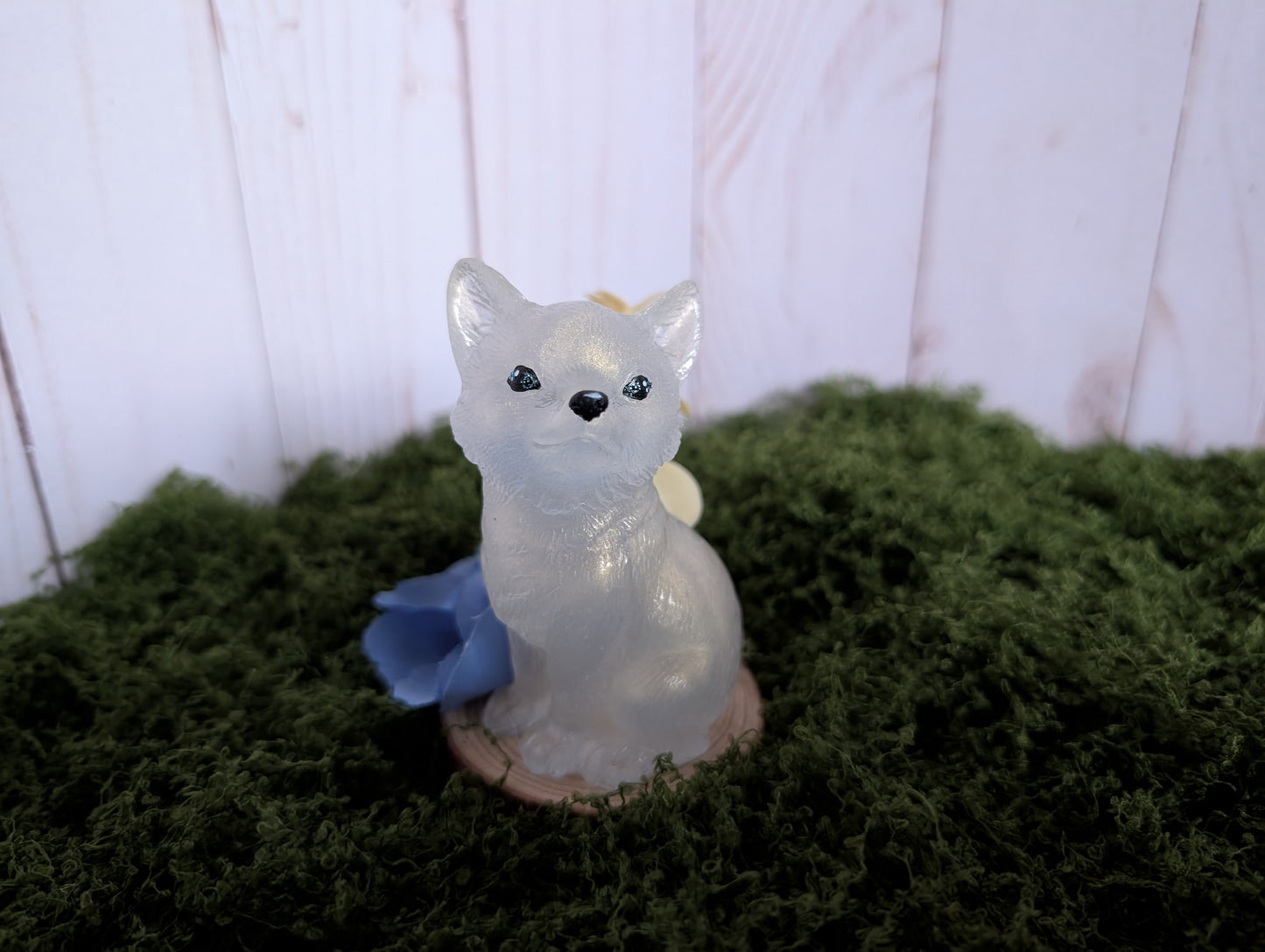 White Puppy with Blue Flower