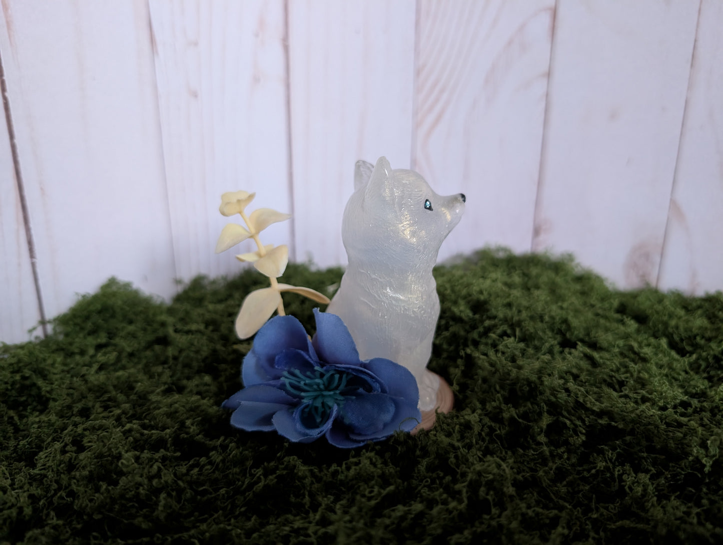 White Puppy with Blue Flower