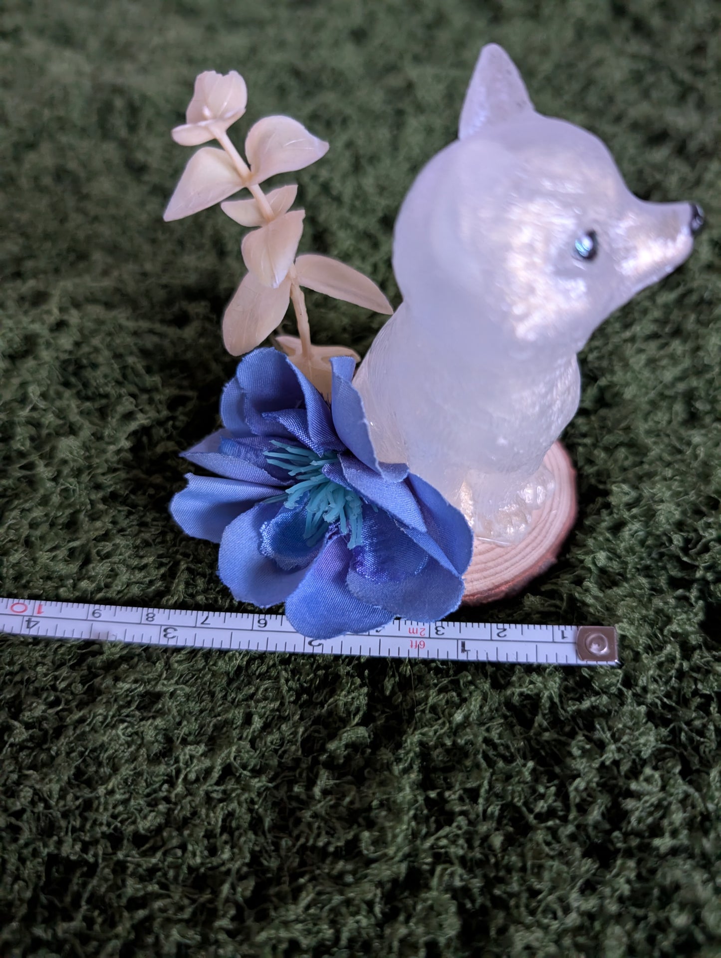 White Puppy with Blue Flower